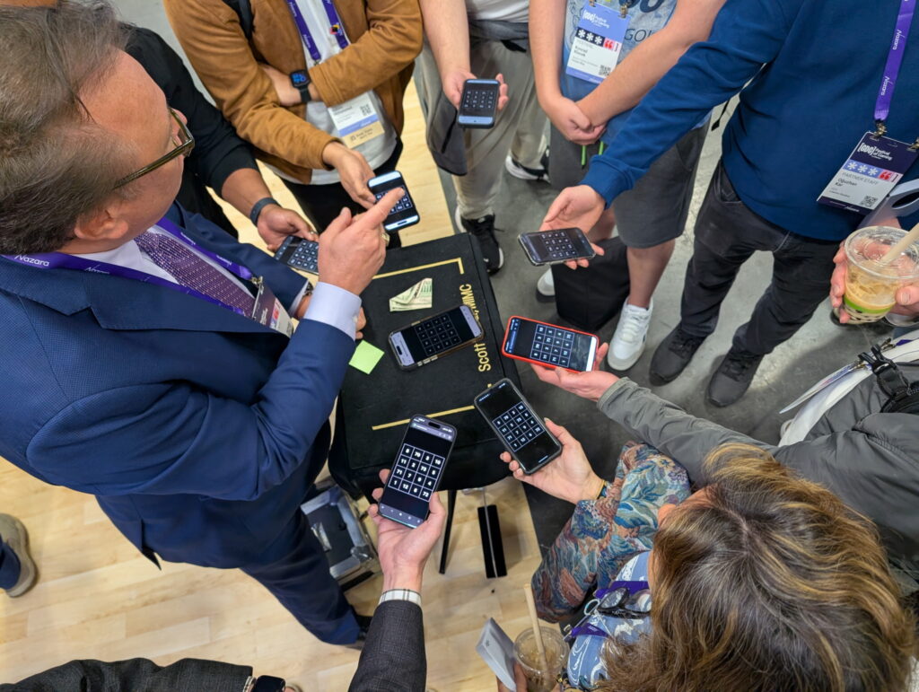 Corporate mentalist in a trade show booth adds a commercial message without magic props.